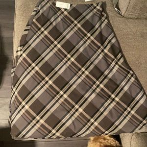 Brand new calf-length skirt with zipper closure in back